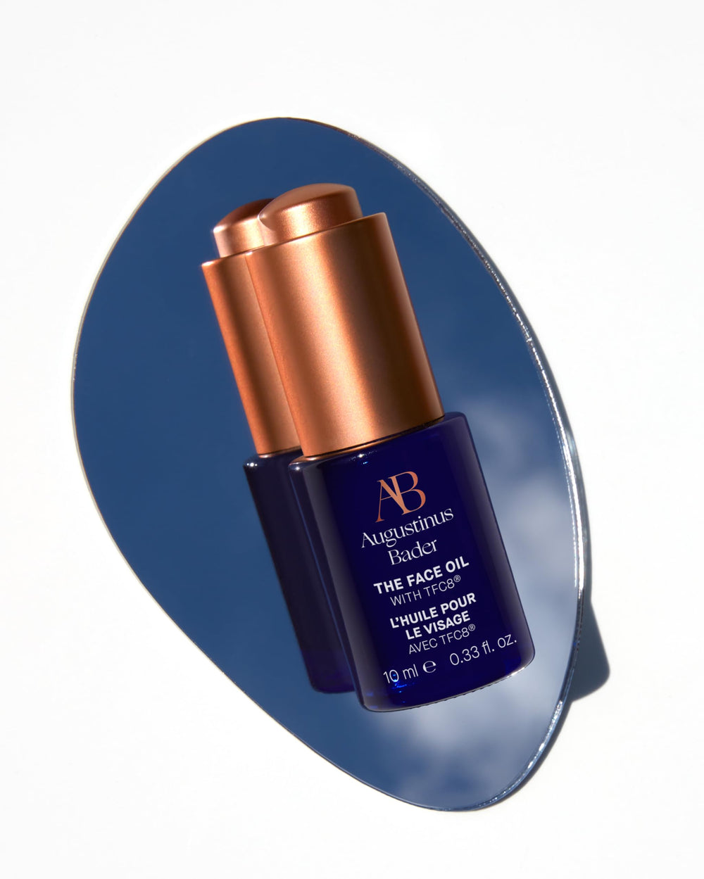 Augustinus Bader The Face Oil texture drop illustrating light, fast-absorbing hydration for all skin types.