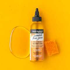 Close-up of bottle being squeezed to apply between hair parts.