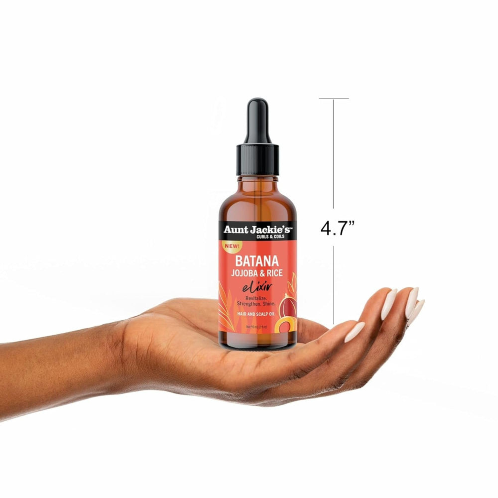 Scalp massage with Batana Oil to moisturize and smooth hair texture