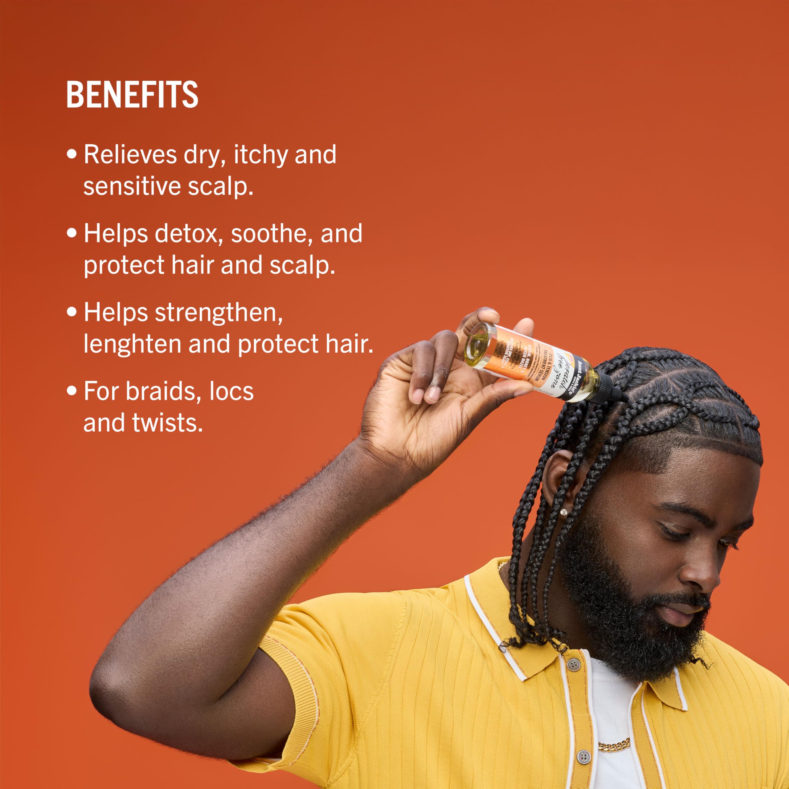 Aunt Jackie's Biotin Honey serum applied to nourish protective styles.