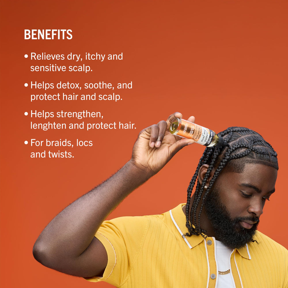Aunt Jackie's Biotin Honey serum applied to nourish protective styles.