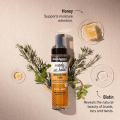 Aunt Jackie's bottle label close-up highlighting Biotin and Honey benefits.