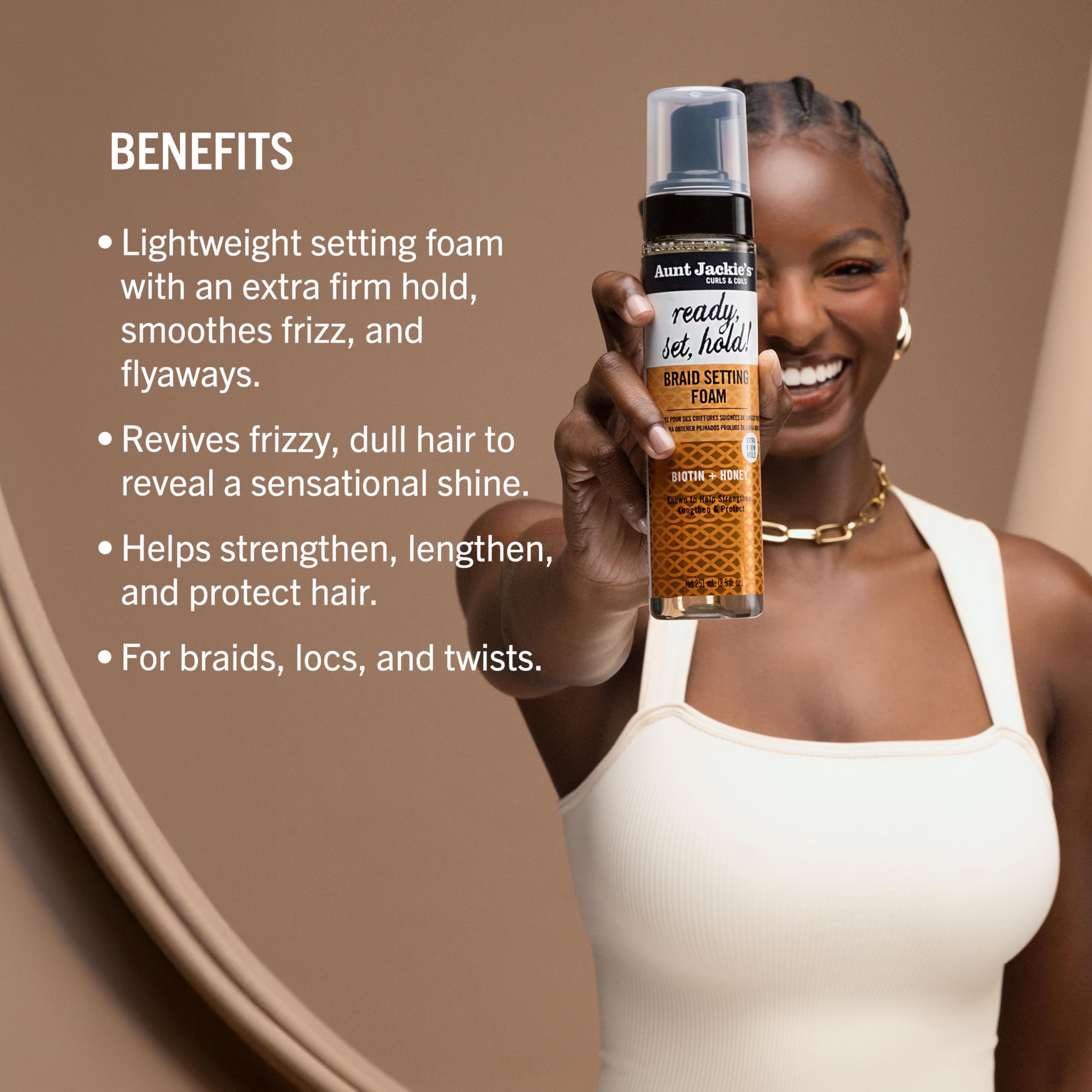 Aunt Jackie's model shows braided hair with foam for sleek twists.