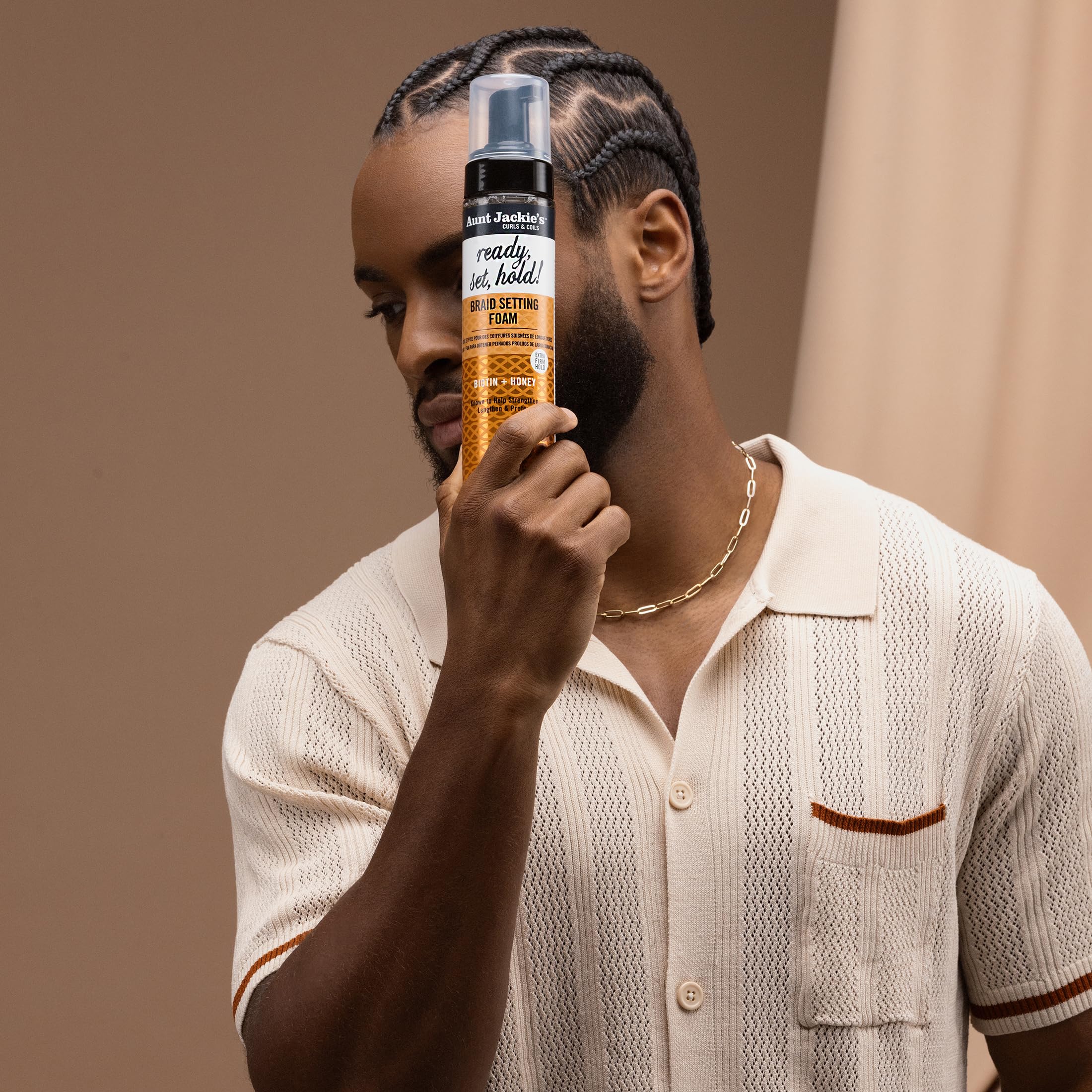 Aunt Jackie's smoothing frizz on braids for a cleaner, defined look.