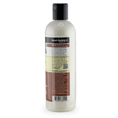 Aunt Jackie's Coconut Milk conditioning cleanser close-up shows creamy texture for curls