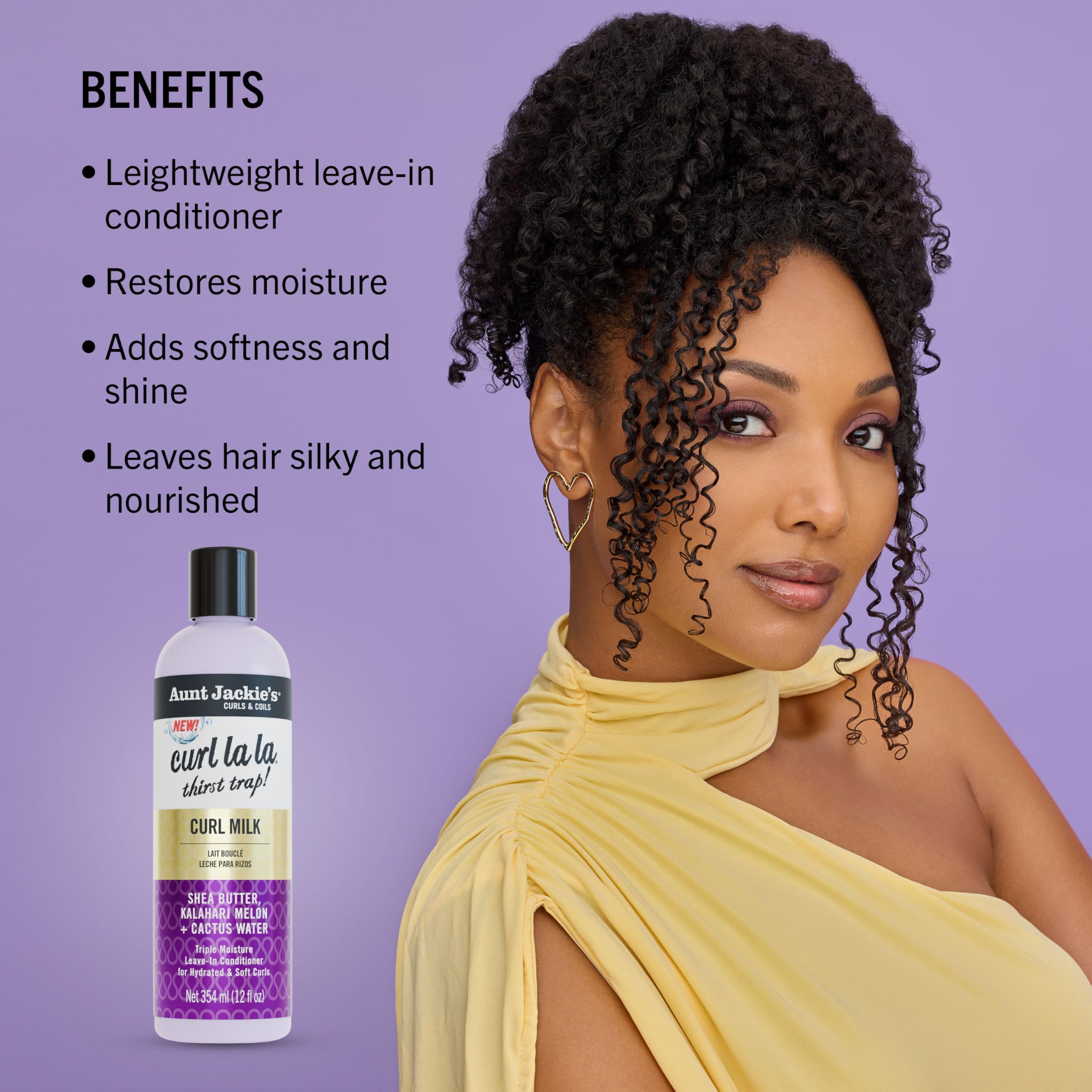 Aunt Jackie's Curl La La Milk in hands ready to soften and detangle strands
