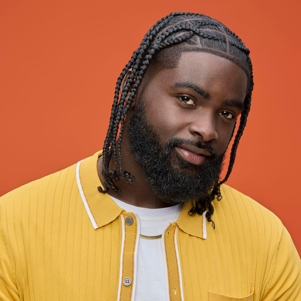 Product in a setting with braids or locs to show usage.