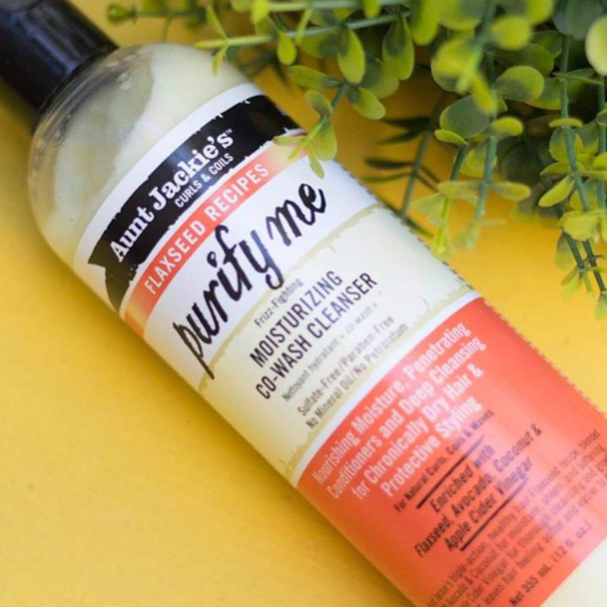 Purify Me Co-Wash ingredients flaxseed avocado and coconut in focus.