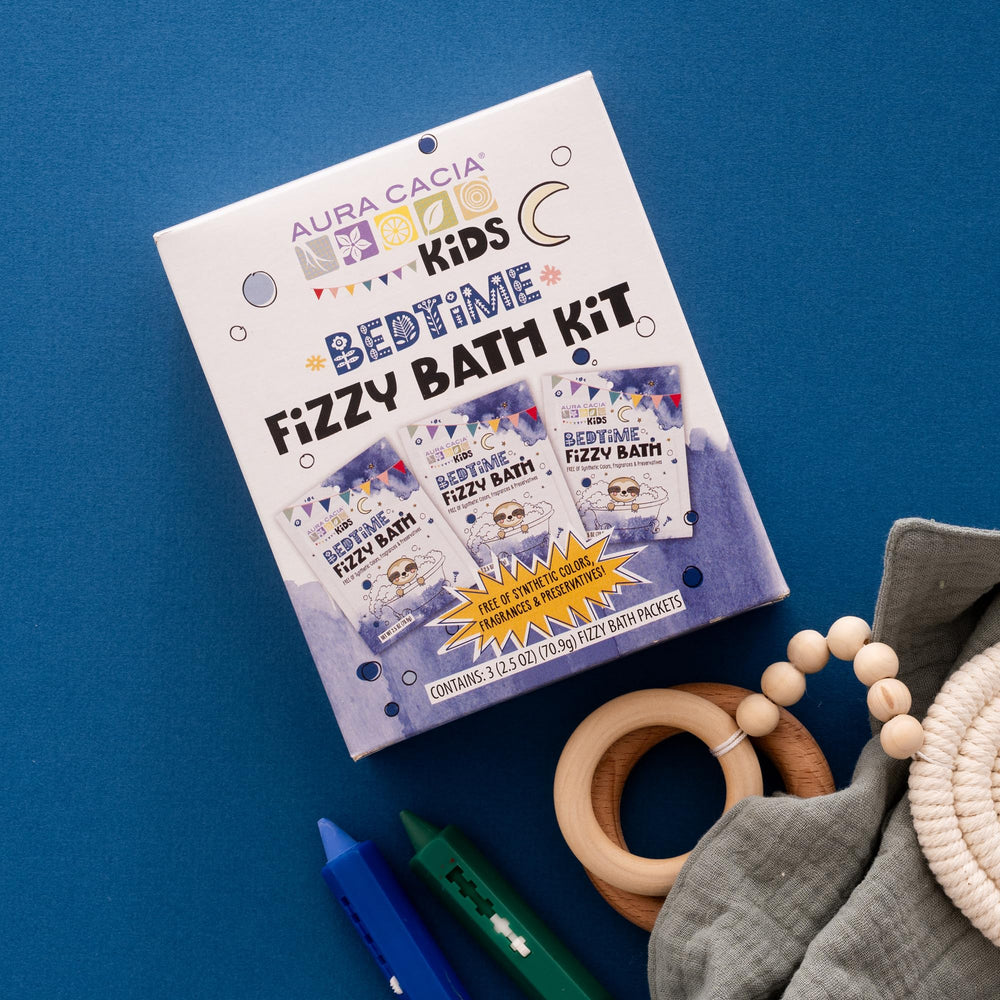 Aura Cacia Kids Bedtime Fizzy Bath Kit ingredient closeup highlights natural oils.