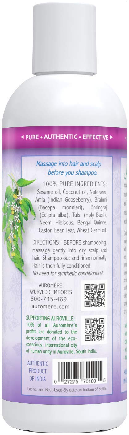 Applying Auromere pre-shampoo conditioner to scalp for smoother roots.