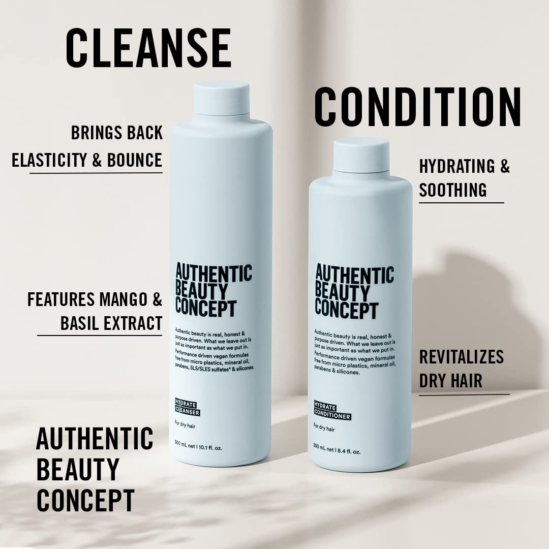 Authentic Beauty Concept Hydrate Cleanser pour demonstrating gentle cleansing on curly hair