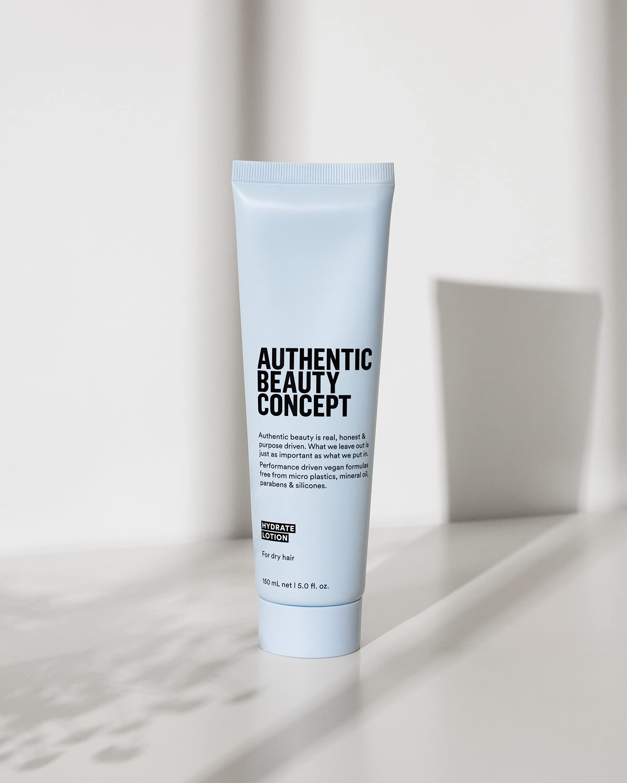 Authentic Beauty Concept Hydrate Lotion soft-shine finish on damp hair boosts vitality