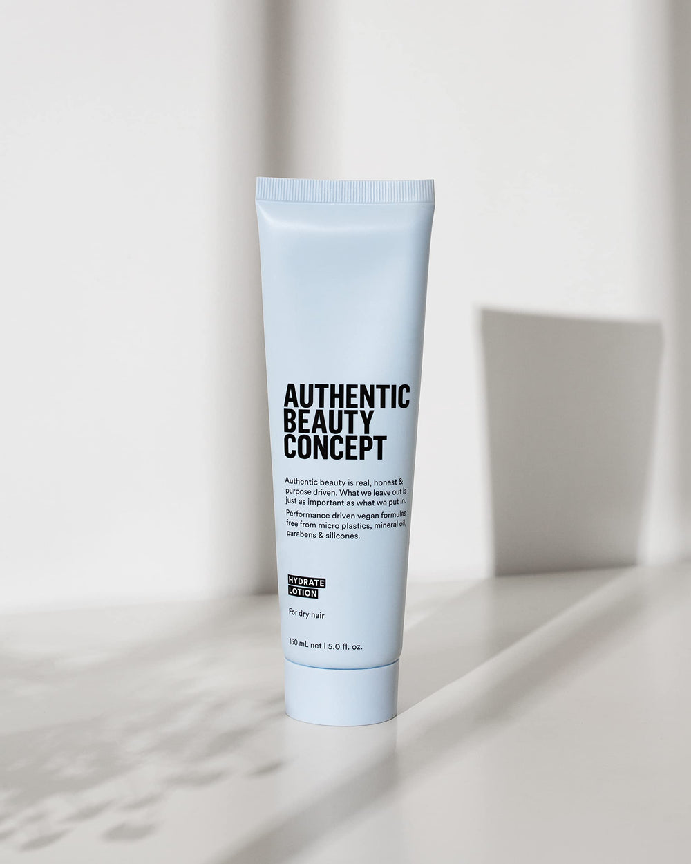 Authentic Beauty Concept Hydrate Lotion soft-shine finish on damp hair boosts vitality