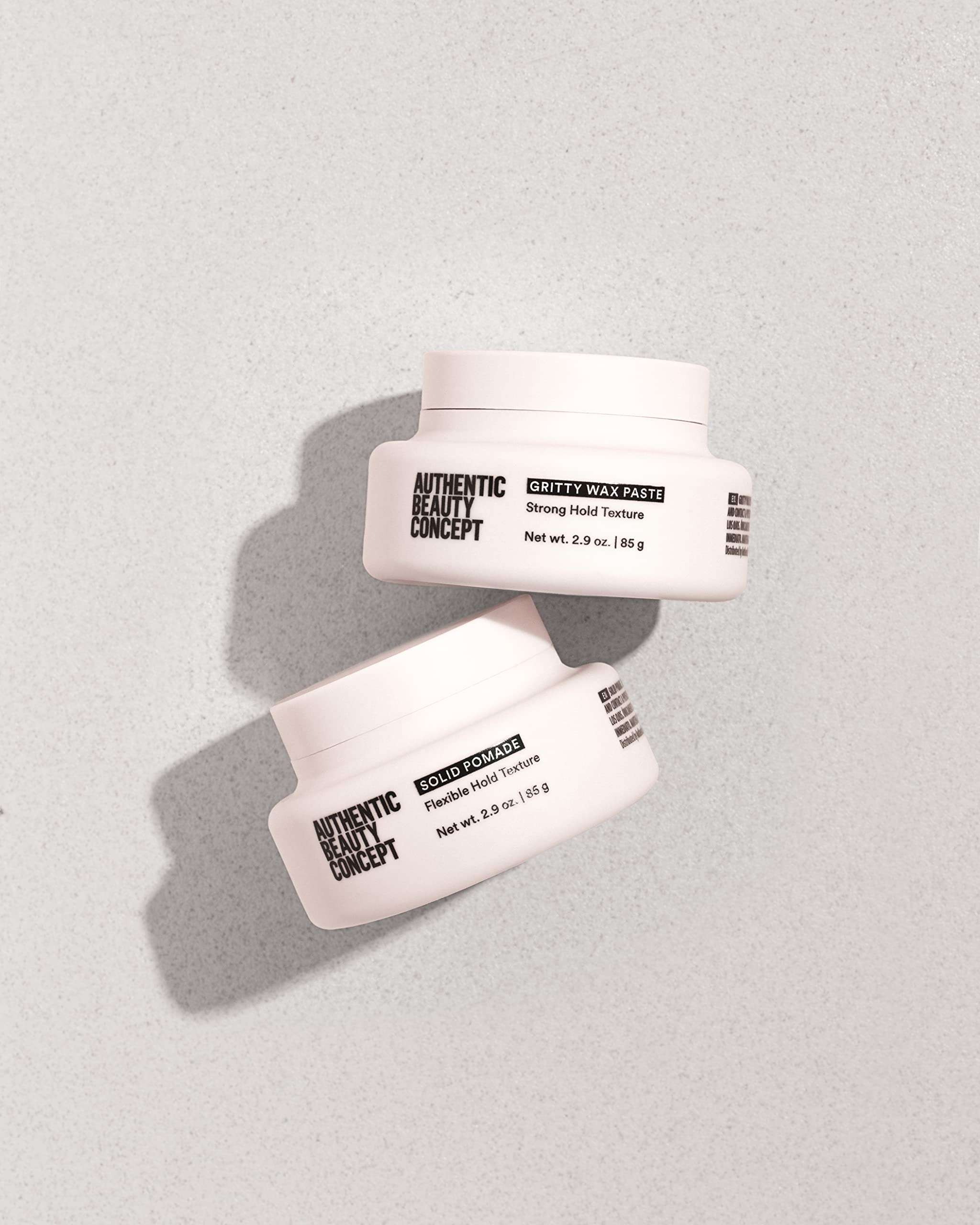 Ingredients vegan and cruelty-free label on Authentic Beauty Concept Solid Pomade packaging.