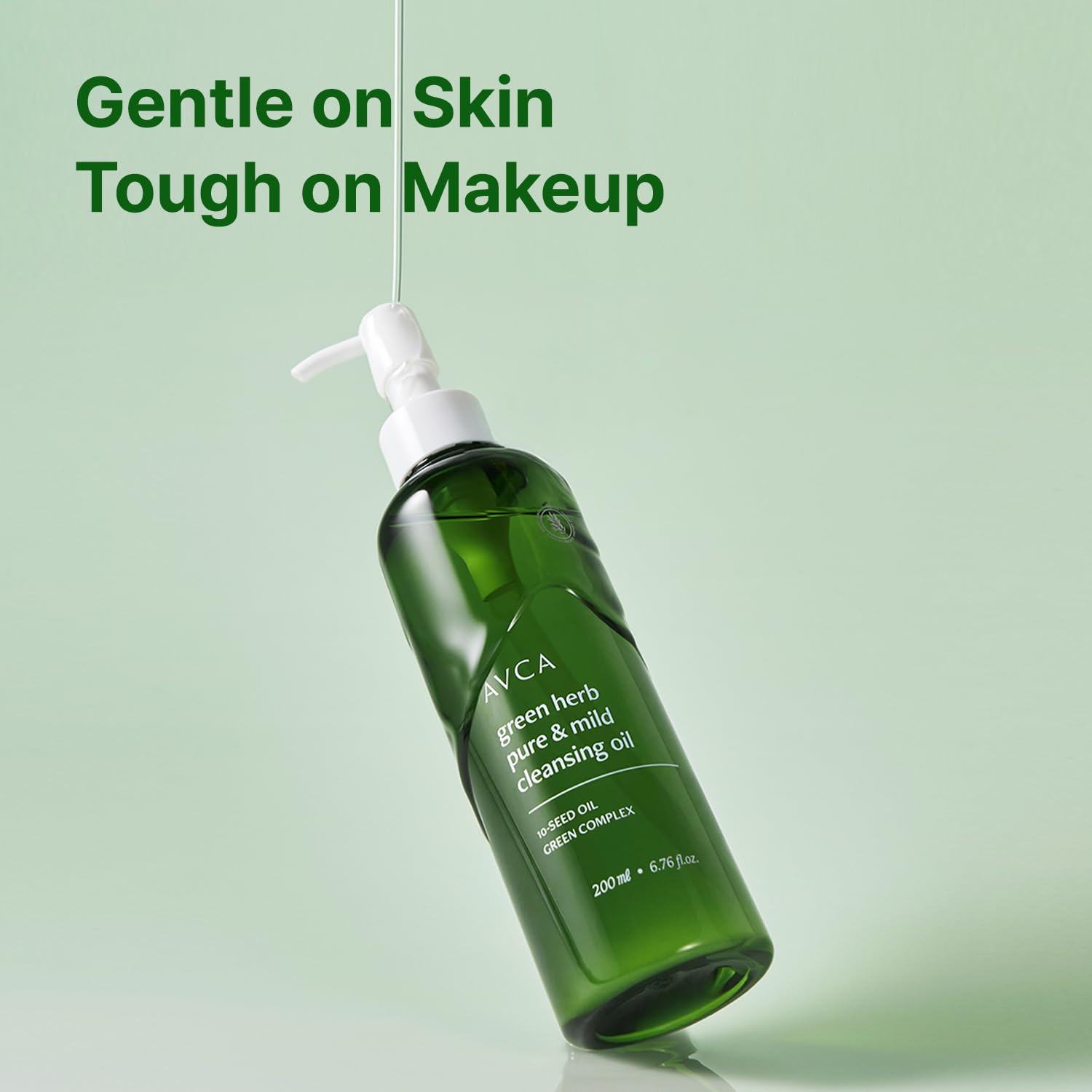 Pouring AVCA Green Herb Blackhead Cleansing Oil shows smooth, clean application.