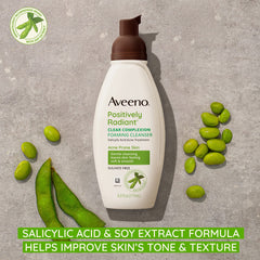 Aveeno foaming cleanser close-up highlights rich lather and gentle cleansing action.