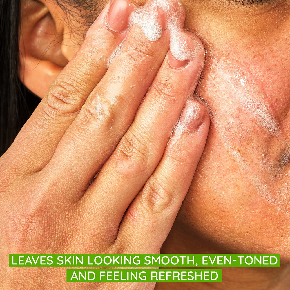 Close-up of Aveeno Positively Radiant scrub with exfoliating granules.