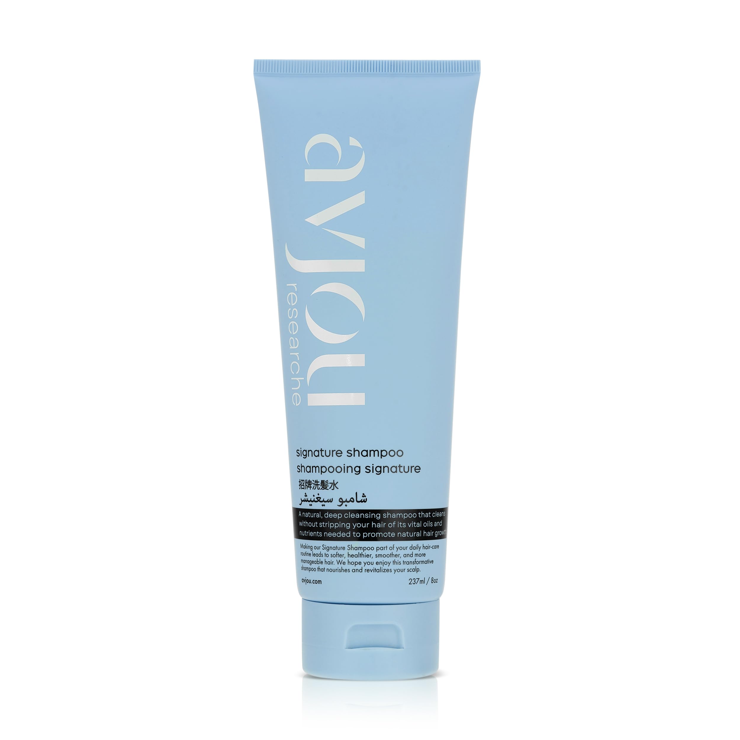 Avjou Researche Signature Shampoo bottle close-up highlighting hydration-rich formula for smooth, shiny hair.