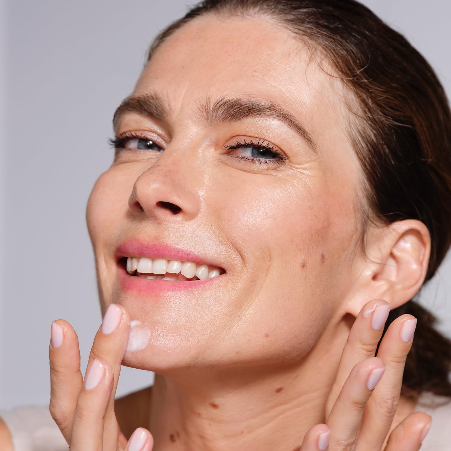 AVON Anew Ultimate Firm and Supple Day Cream SPF20 usage image suggests morning skincare routine