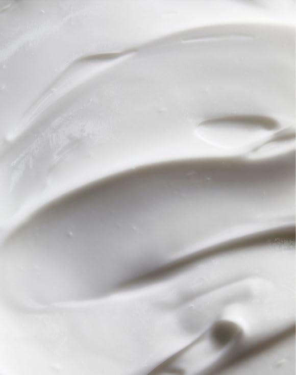 Closeup of AVON Solutions cream texture, rich emollients for dry skin.