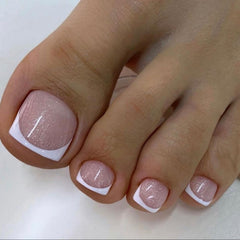 AZPEPSI white French tip toenails with short square shape for natural nude glitter look.