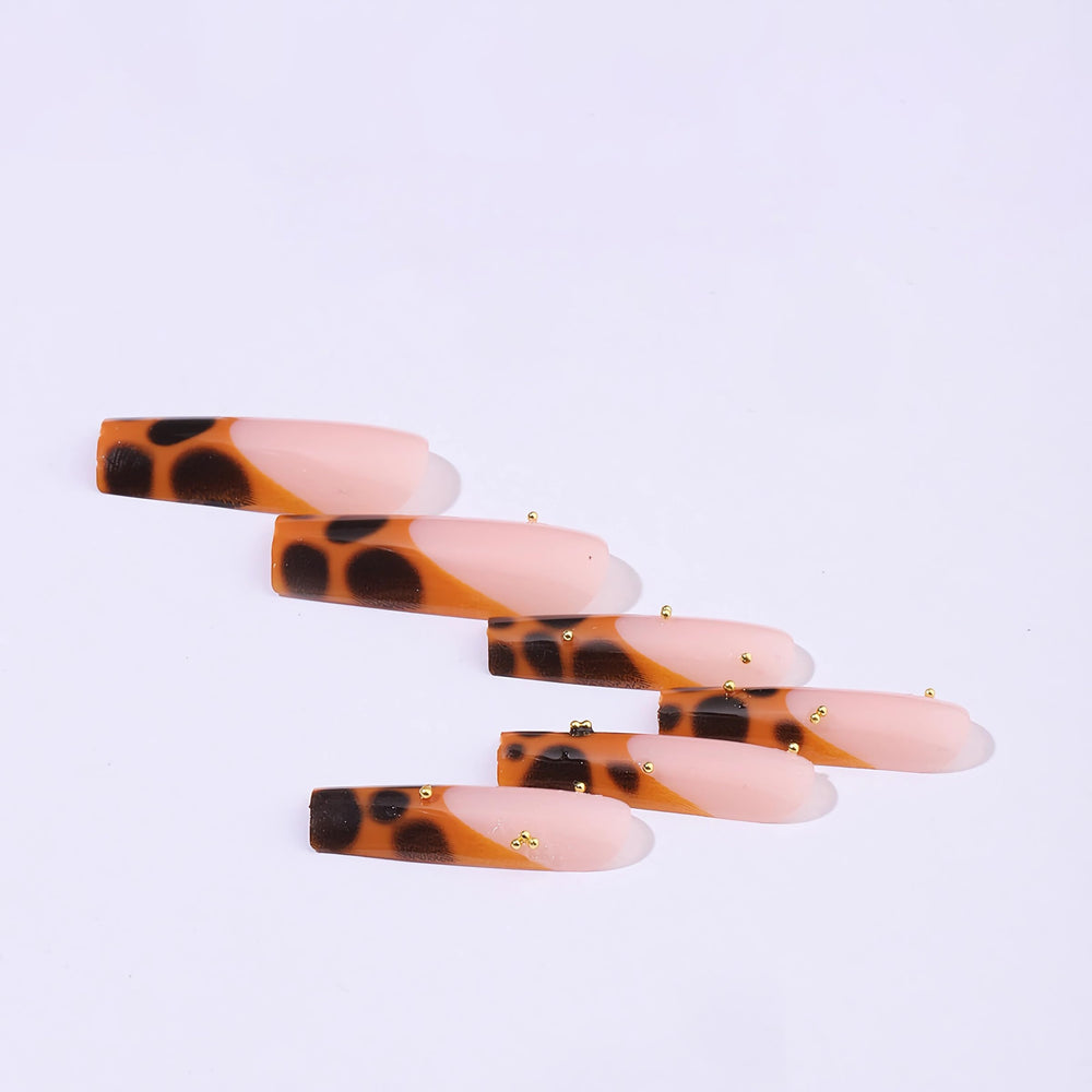 BABALAL long nails in brown French tip cheetah design for party-ready look