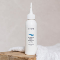 Babe Laboratorios Anti Hair Loss Lotion packaging on a clean display for daily scalp care