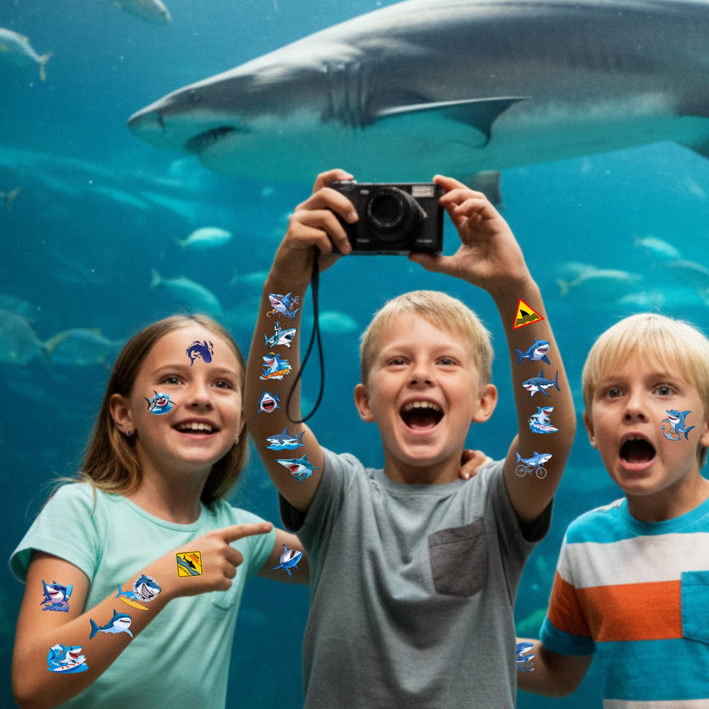 Backtopeia shark tattoos displayed as party favors and decor.