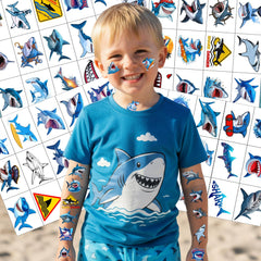 Close-up of Backtopeia shark tattoo sheets with bold marine designs.