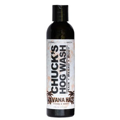 Badass Beard Care Chuck's Hog Wash Havana Haze bottle pour for daily beard cleansing and skin hydration.