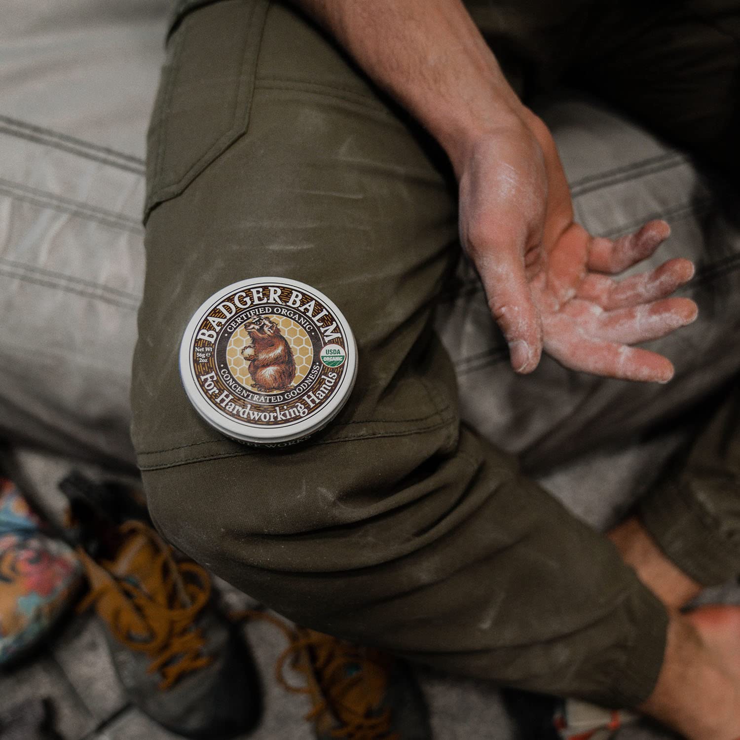 Badger Balm hand application angle showing easy, non-greasy absorption on hands.