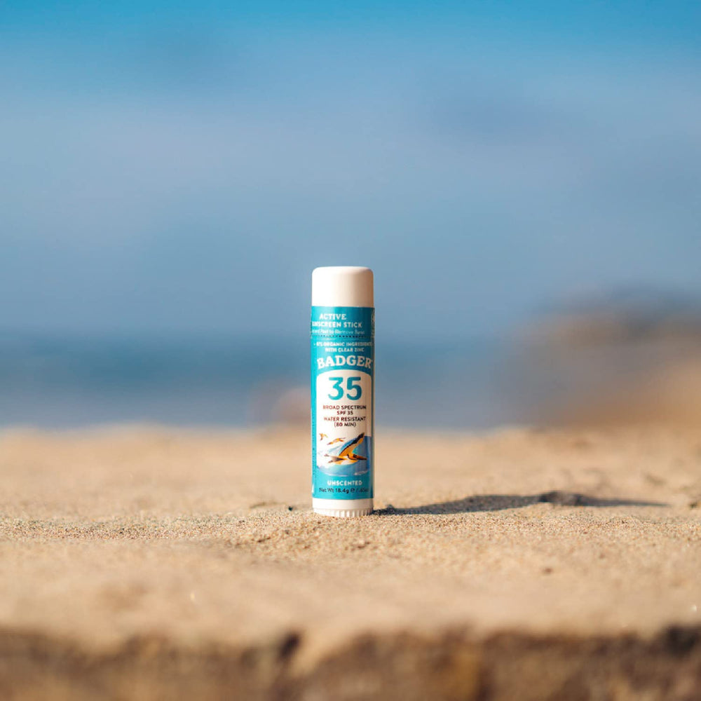 Badger Face Stick in use during outdoor activity with on-skin protection.
