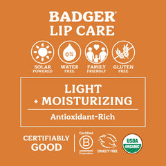 Badger Tangerine Breeze lip balm close-up reveals smooth, silky texture.