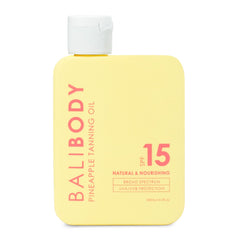 Bali Body Pineapple Tanning Oil bottle highlights SPF15 protection and a sun-kissed glow