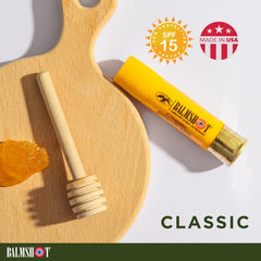 Balmshot lip balm with smooth turning metal base for clean application.