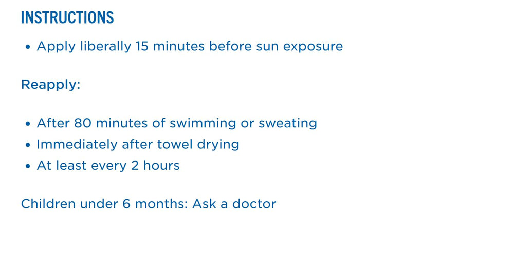 Kids applying sunscreen during beach day on sunny dunes