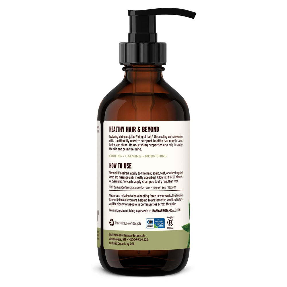 8 oz Banyan Botanicals Bhringaraj oil bottle on a bathroom shelf.