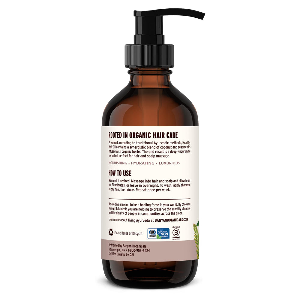 Banyan Botanicals Organic Hair Oil packaging emphasizes eco-friendly sourcing.