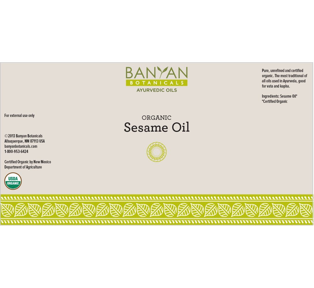 Sesame oil golden hue labeled Banyan Botanicals for hair and skin use.