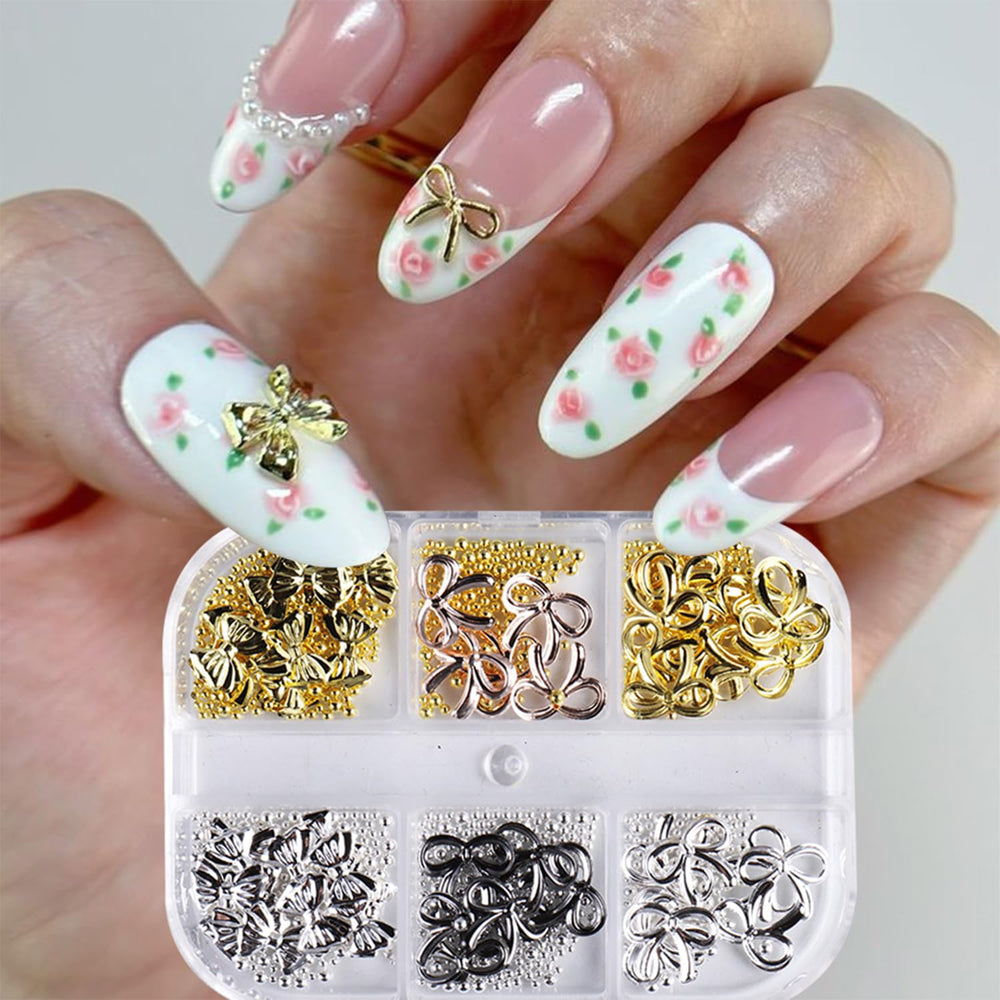 Baoyaalin gold bow nail charms add luxe sparkle to manicures.