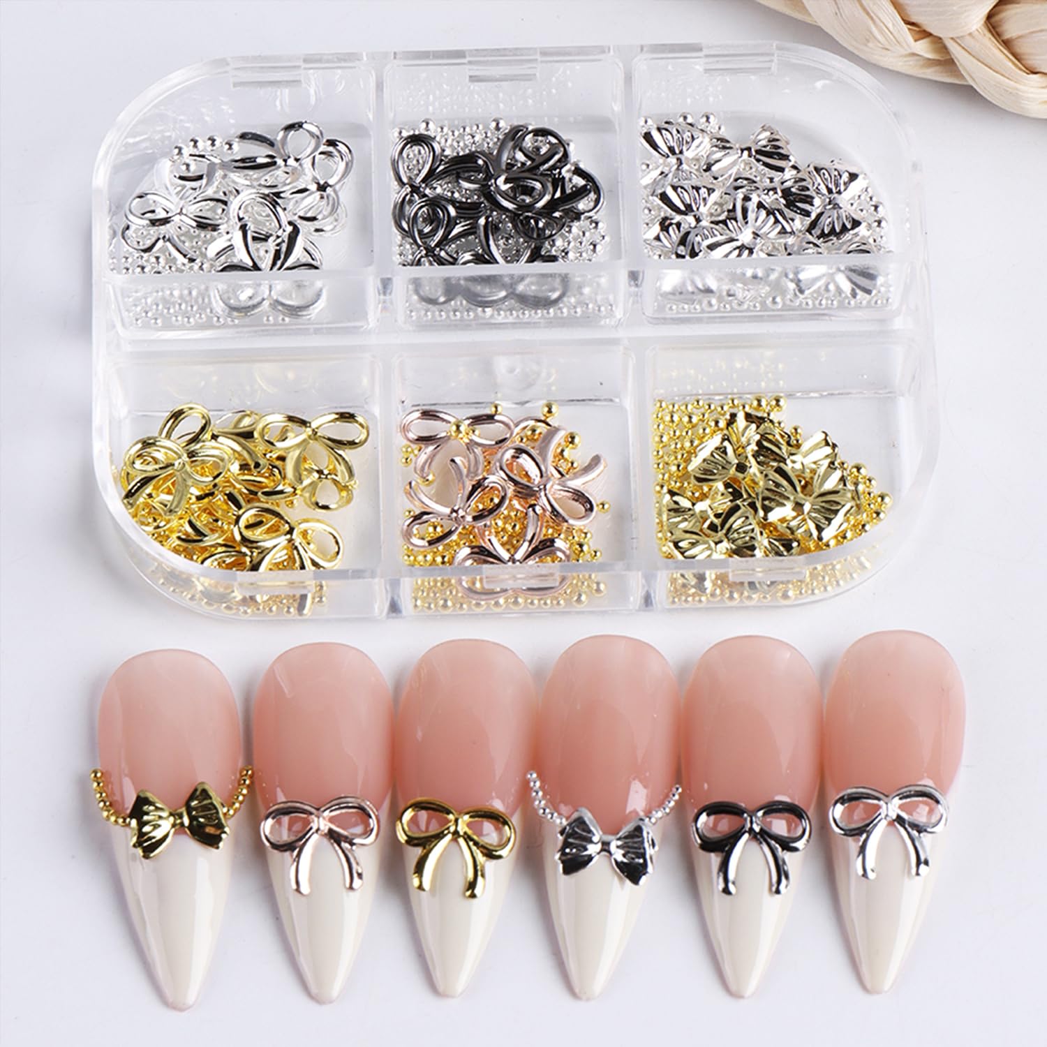 Baoyaalin silver bow nail charms shine on tips for festive looks.