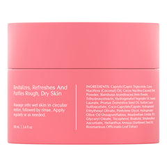 Applying Bare August Foot Scrub in circular motions on feet.