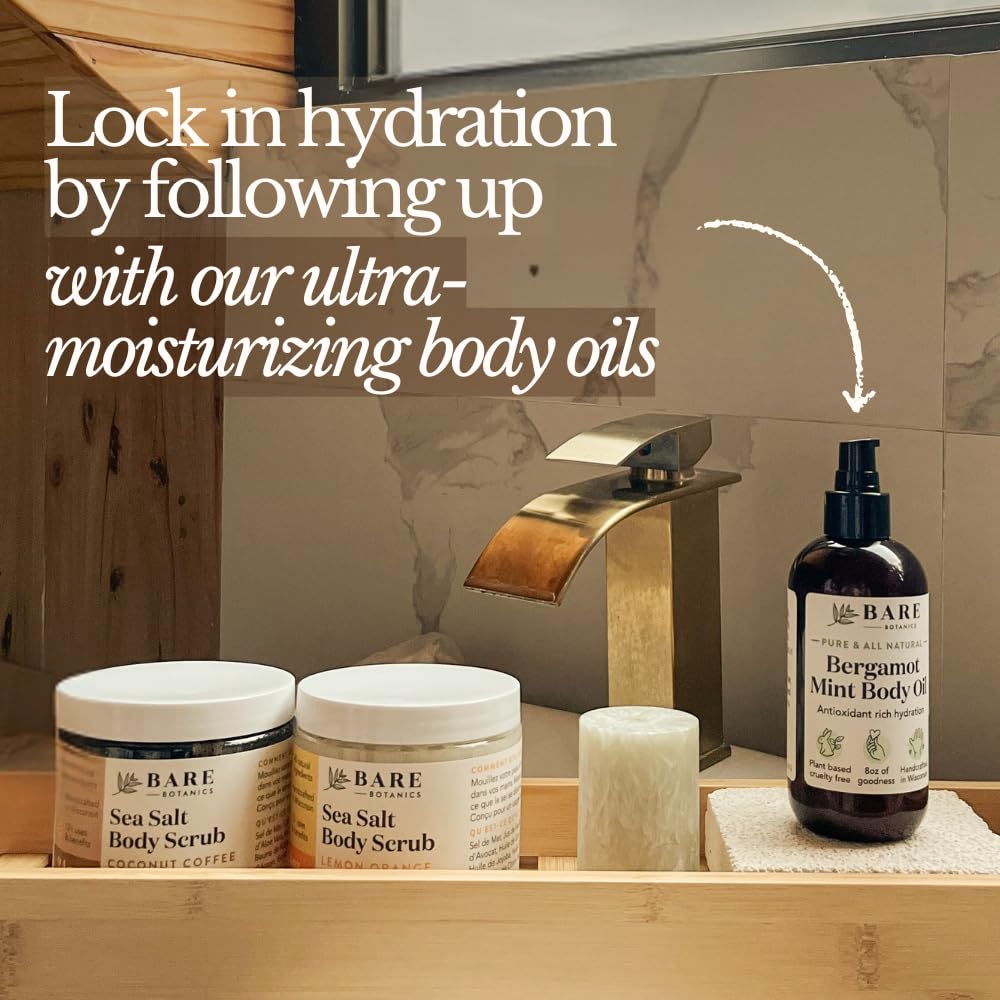 Hands applying Bare Botanics scrub to damp skin for exfoliation