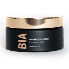 Bare It All Whipped Body Creme bottle pour shows smooth, moisturizing application