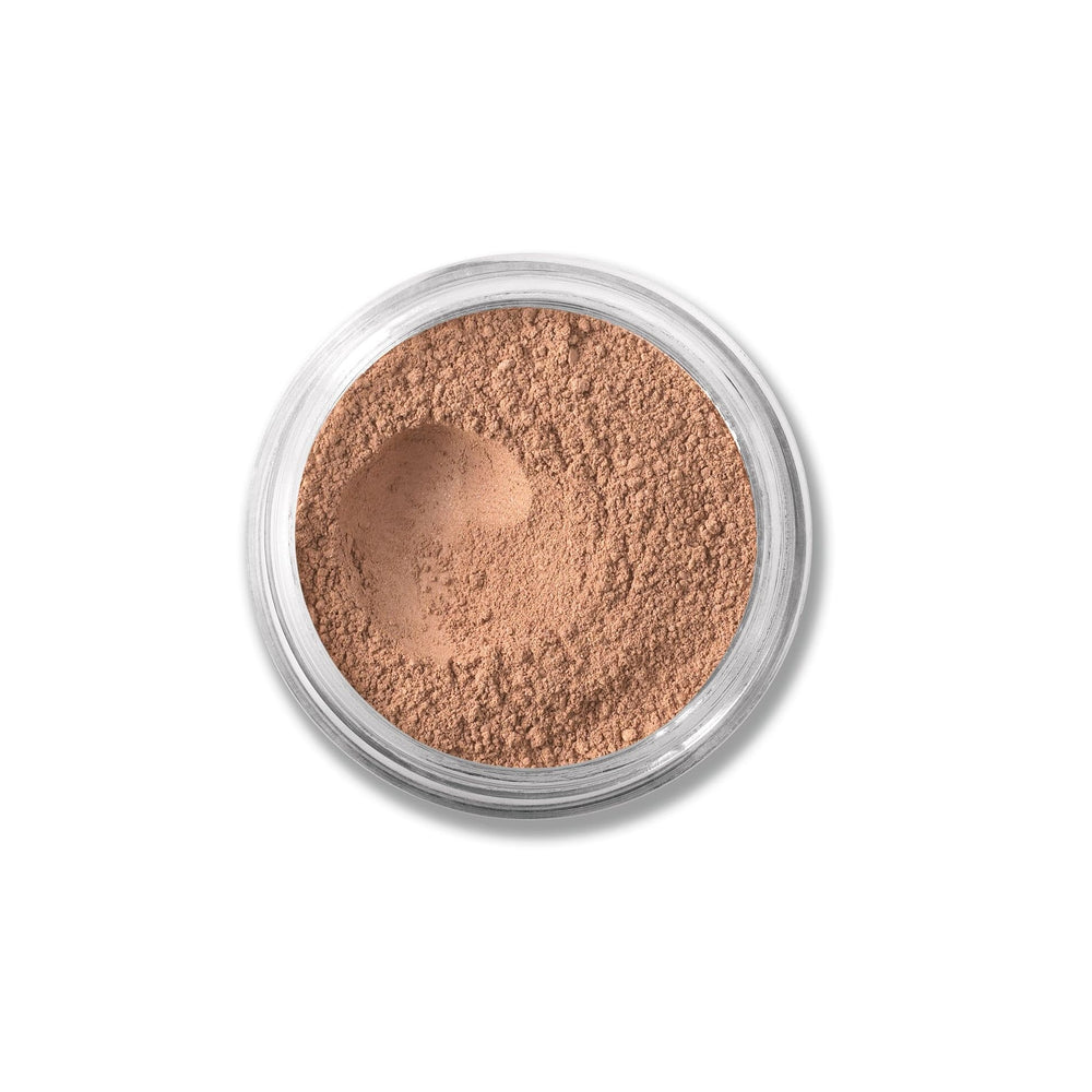 bareMinerals loose powder concealer in Honey Bisque close-up showing natural coverage.