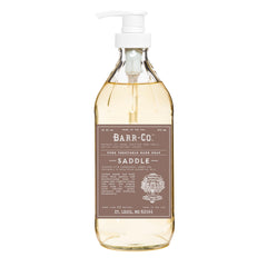 BARR-CO Saddle Hand Soap bottle highlights amber glass with warm sandalwood musk aroma for a cozy bathroom ritual