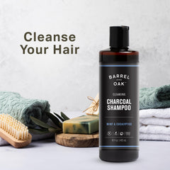 Barrel & Oak charcoal shampoo lather shown for clarifying cleanse.