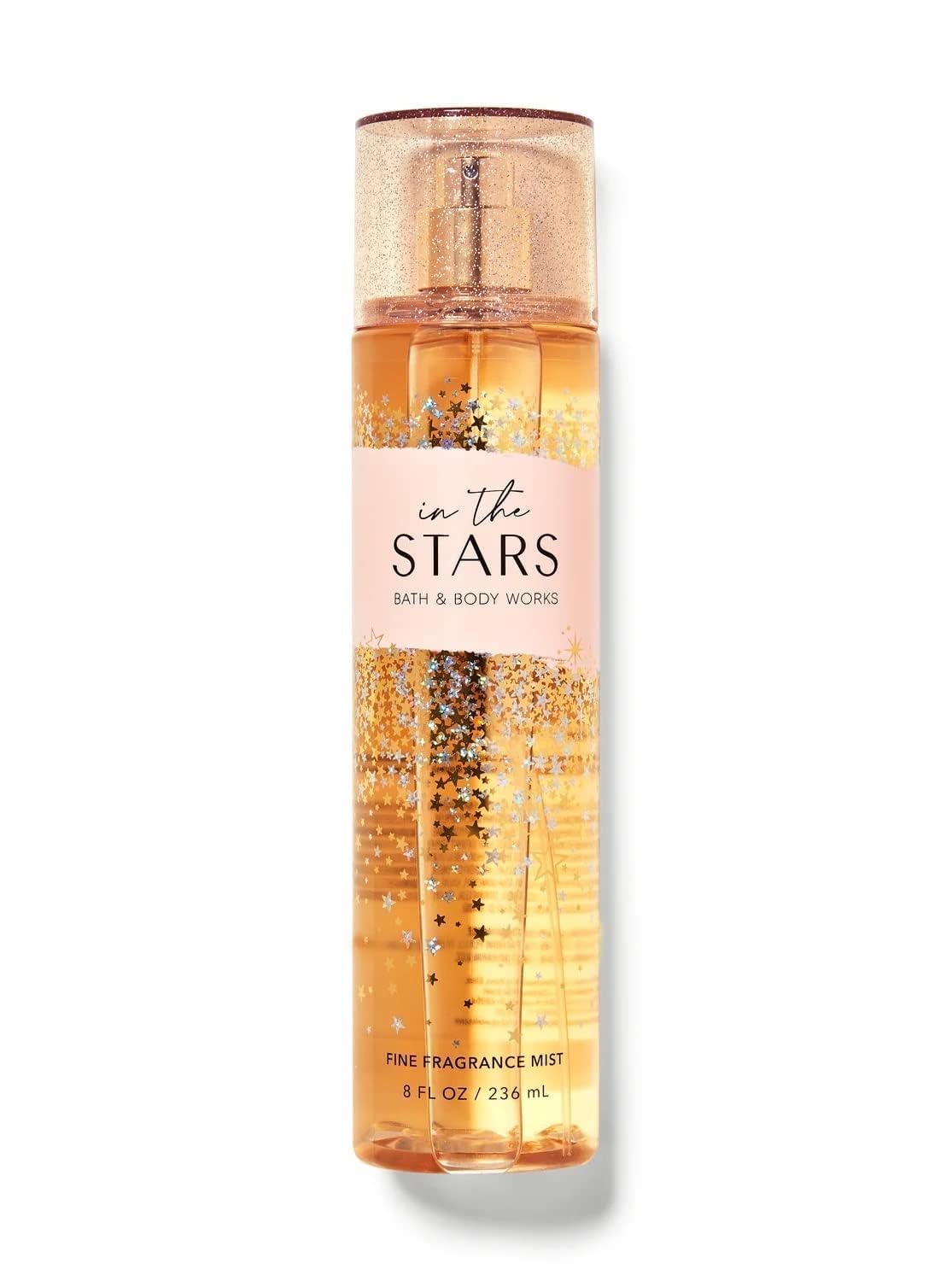 Radiant mist on skin suggests subtle glow and long-lasting aroma.