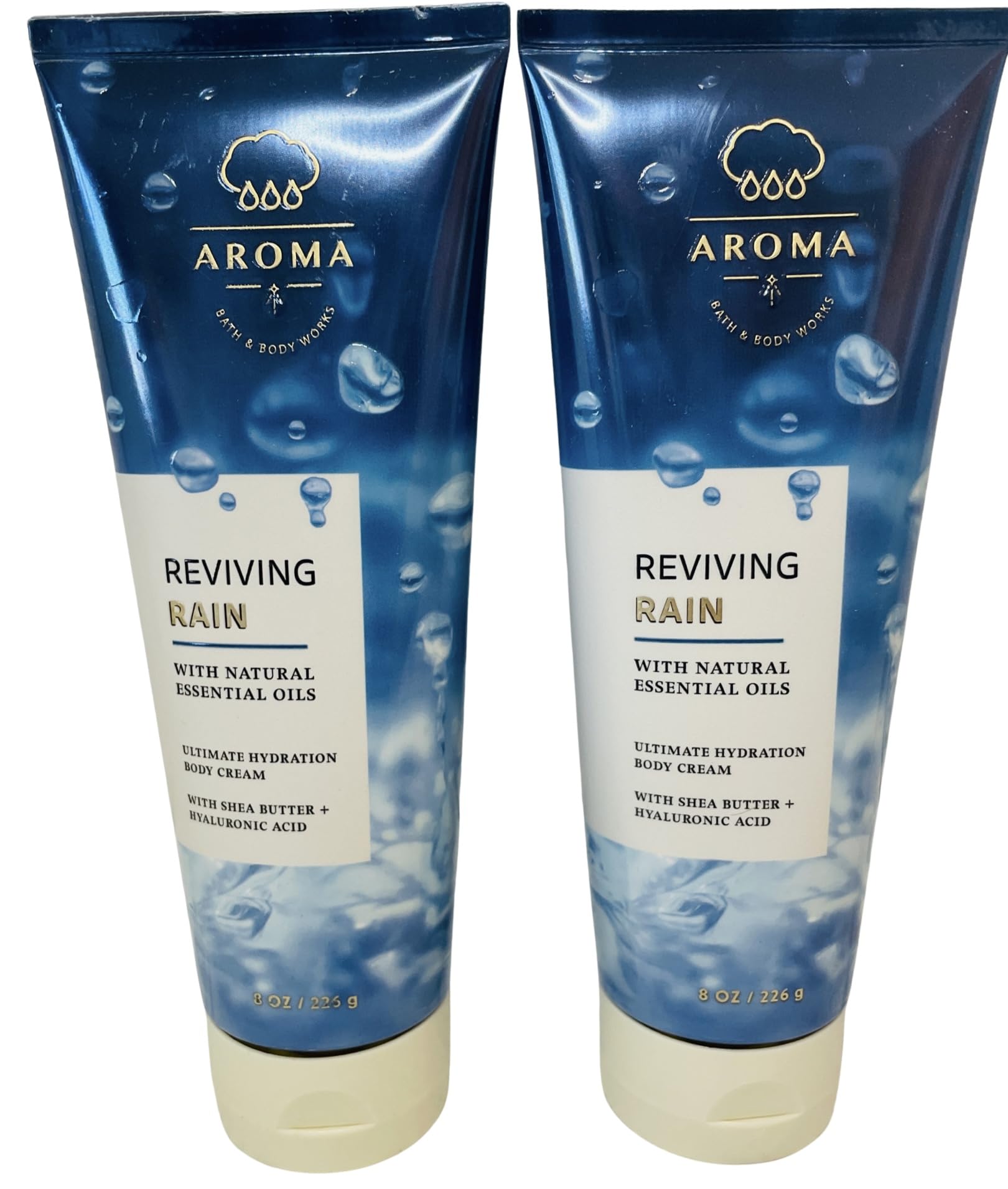 Bath & Body Works Reviving Rain body cream bottle visible, offering lasting hydration and a refreshing scent.