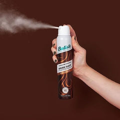 Batiste Dry Shampoo Dark & Deep Brown canister on shelf in pack of three